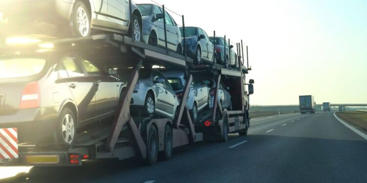 vehicle transporter loaded with cars